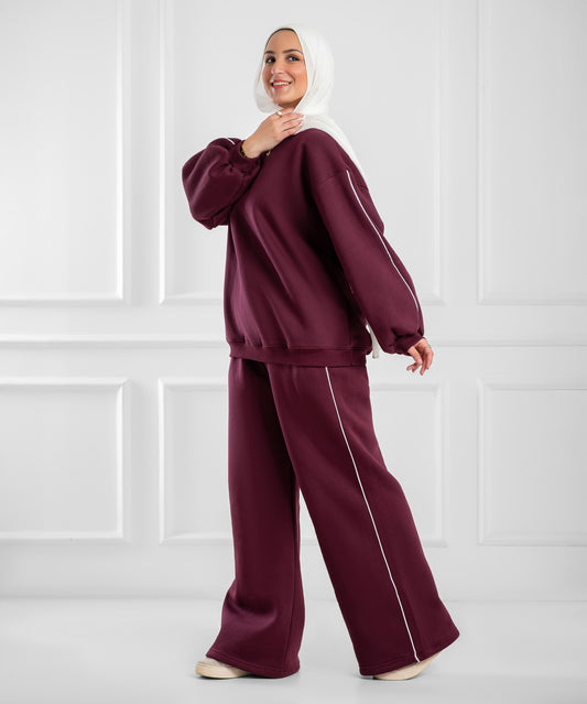 Pink balloon-sleeve lounge set by Akira, featuring a relaxed fit and comfortable fabric, shown on a hanger.