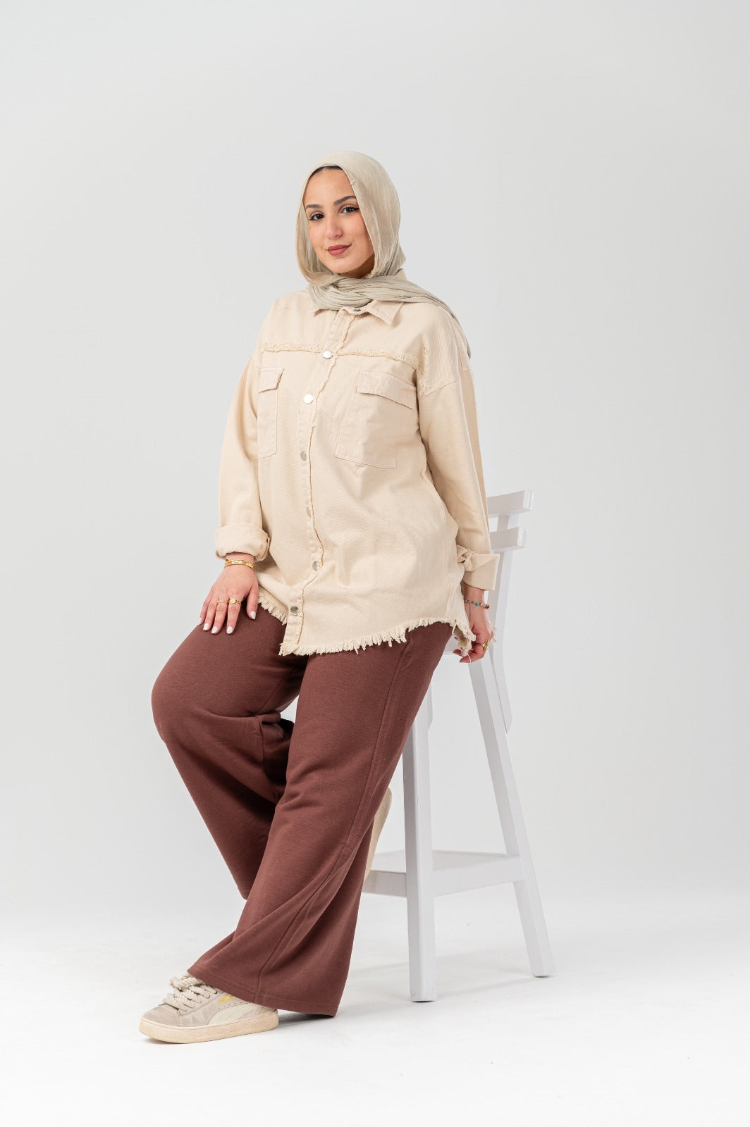 Akira distressed denim shirt with a casual fit and faded distressed details, shown on a plain background.