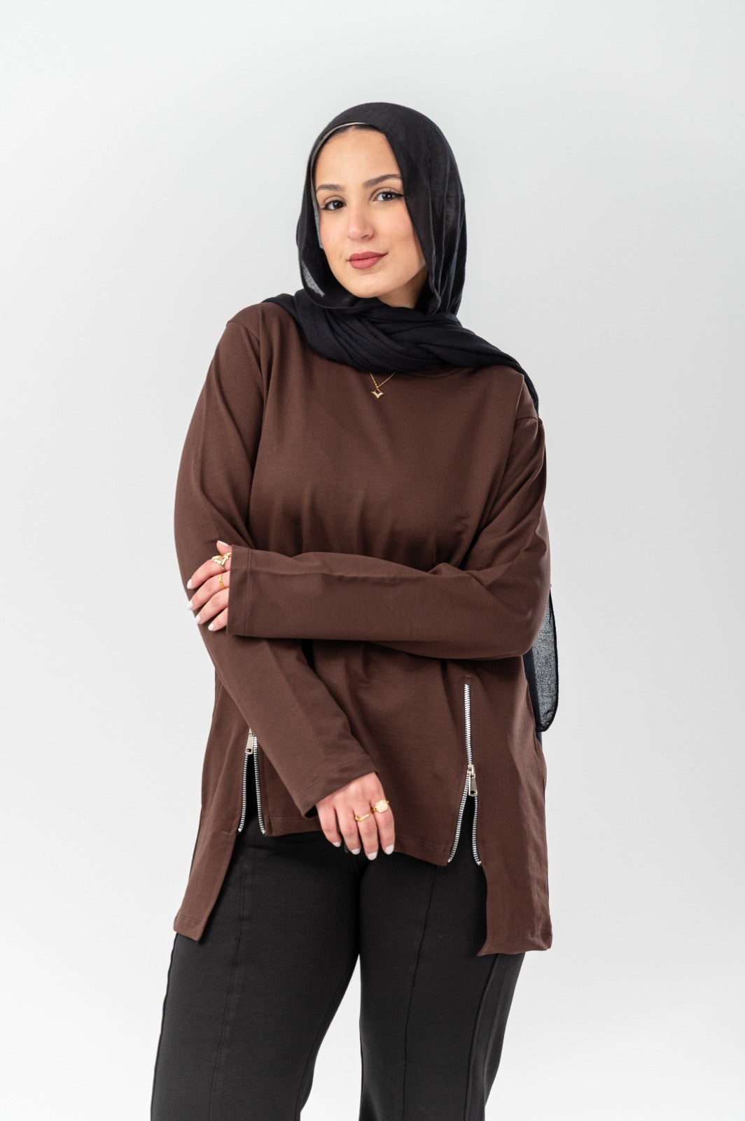 Black side-zip longline T-shirt by Akira featuring a relaxed fit and extended hem, styled with casual urban fashion.