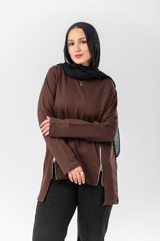 Black side-zip longline T-shirt by Akira featuring a relaxed fit and extended hem, styled with casual urban fashion.