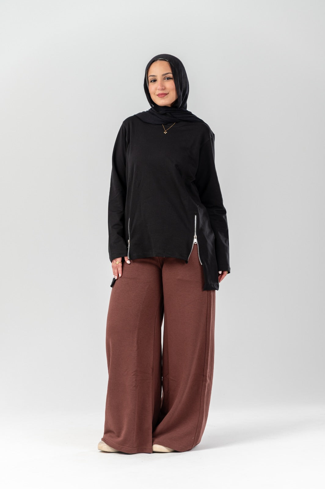 Side-zip longline t-shirt by Akira, featuring a relaxed fit and extended length, shown on a model against a neutral background.