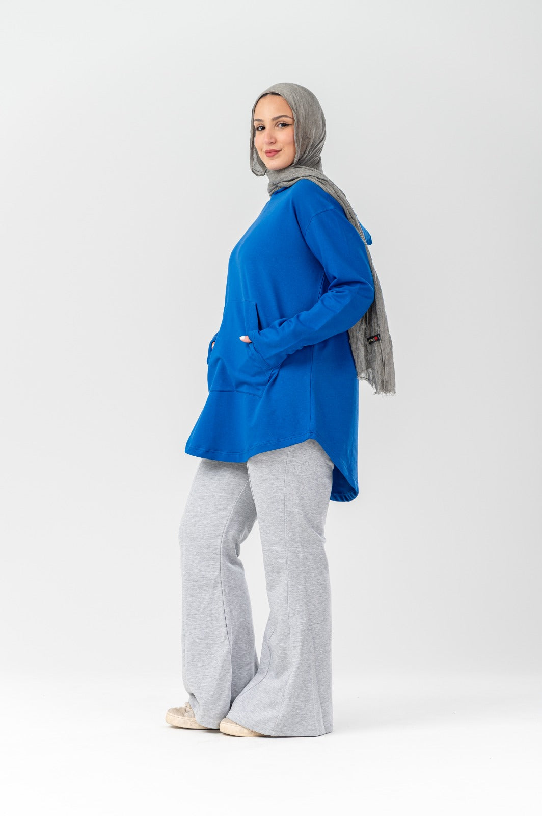 Blue hoodie by Akira featuring a casual fit and soft fabric, shown on a hanger with a front view.