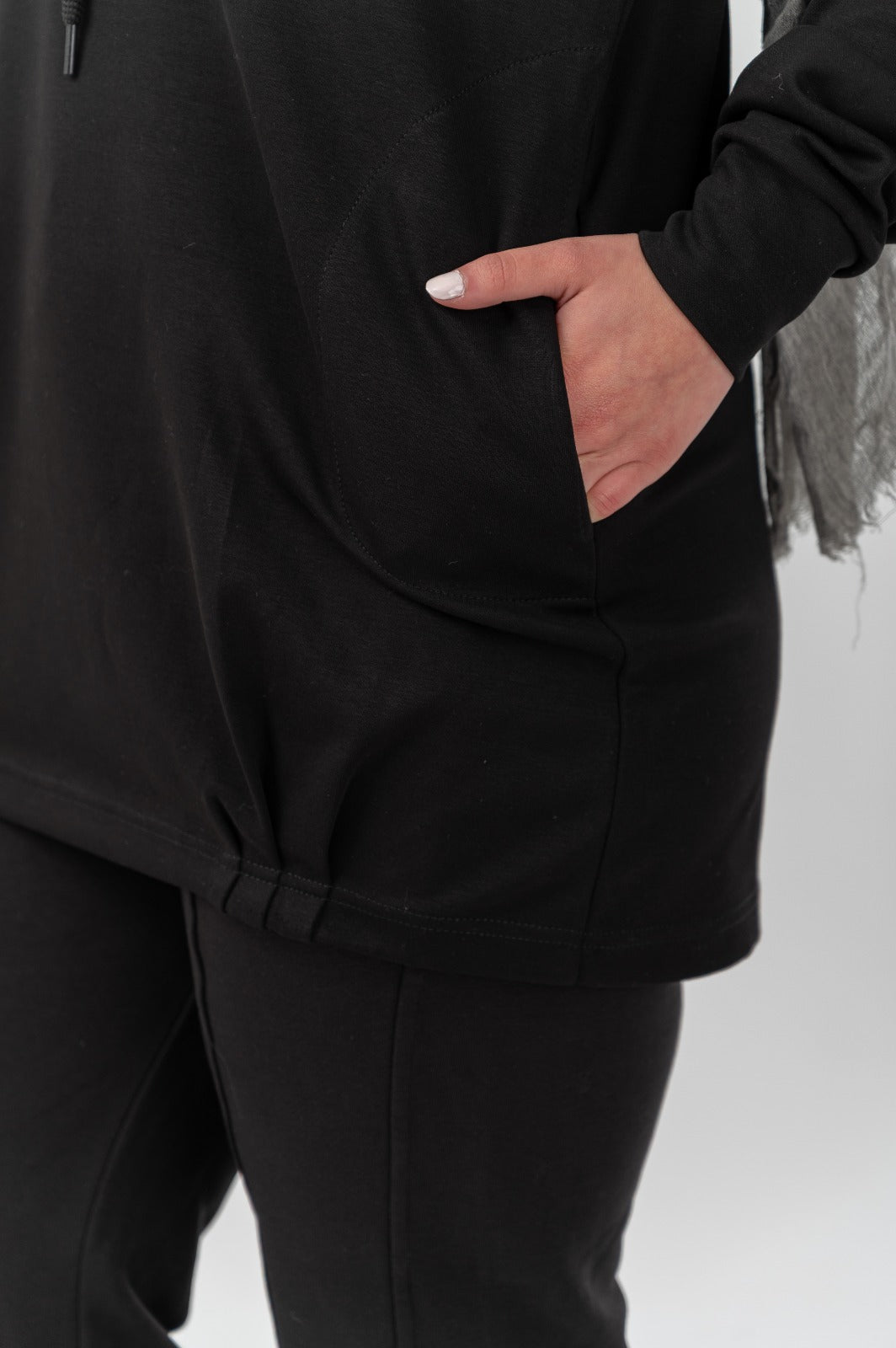 Black Comfort Hoodie by Akira, showcasing a cozy, relaxed fit with a front pocket and hood, ideal for casual wear.