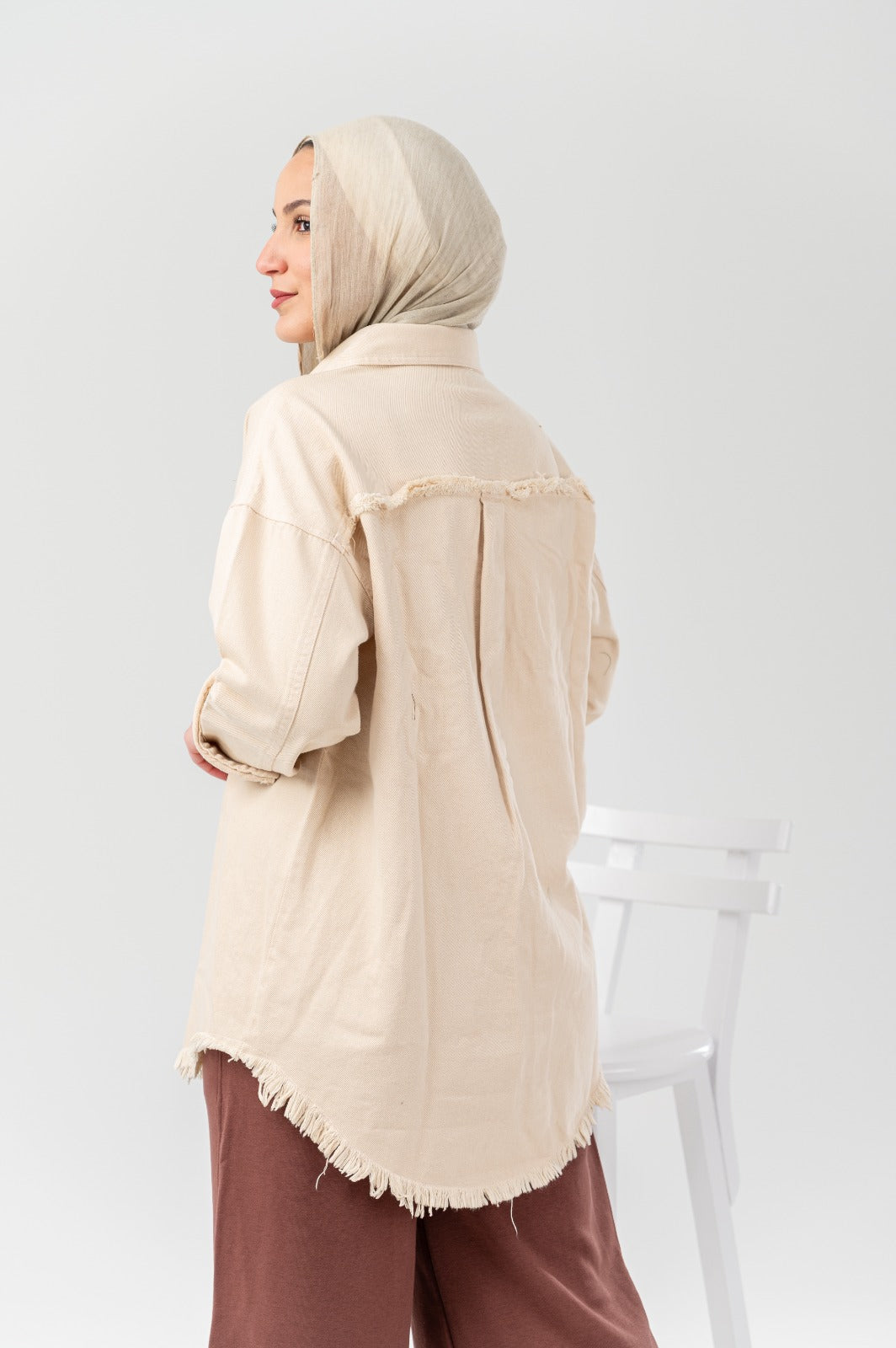 Akira distressed denim shirt with ripped details and long sleeves, casual stylish top for a trendy look.