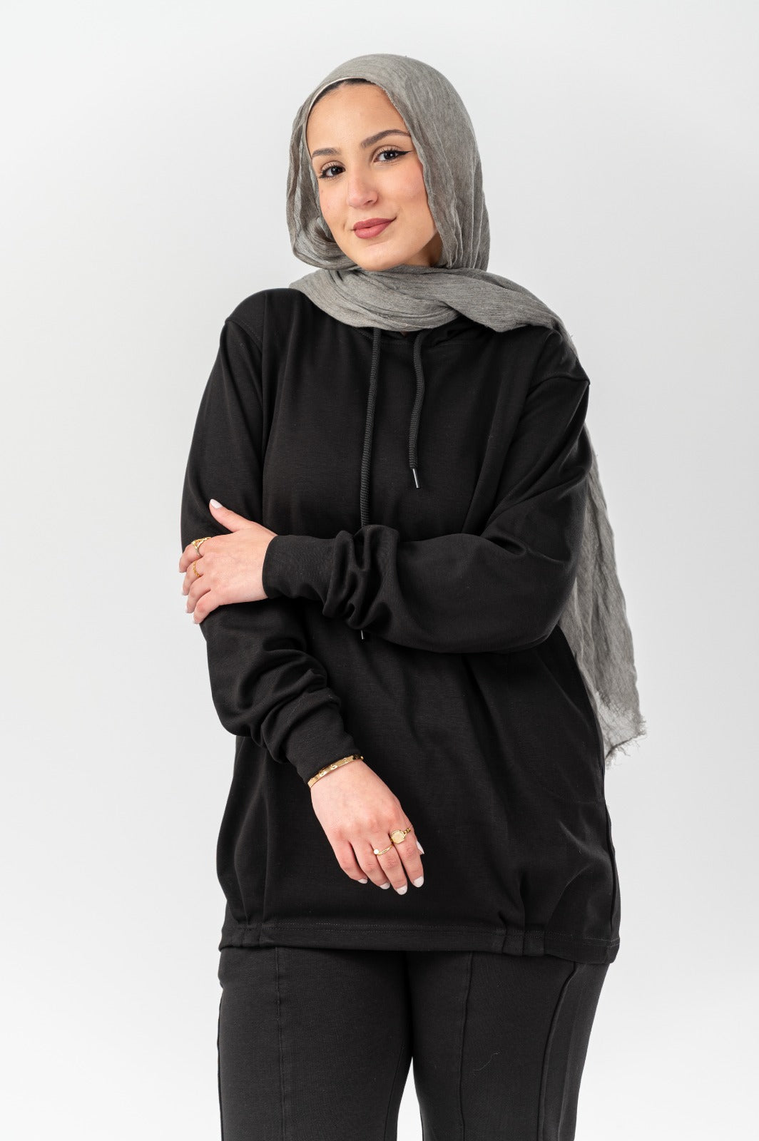 Black Comfort Hoodie by Akira, featuring a relaxed fit and soft fabric, displayed on a mannequin.