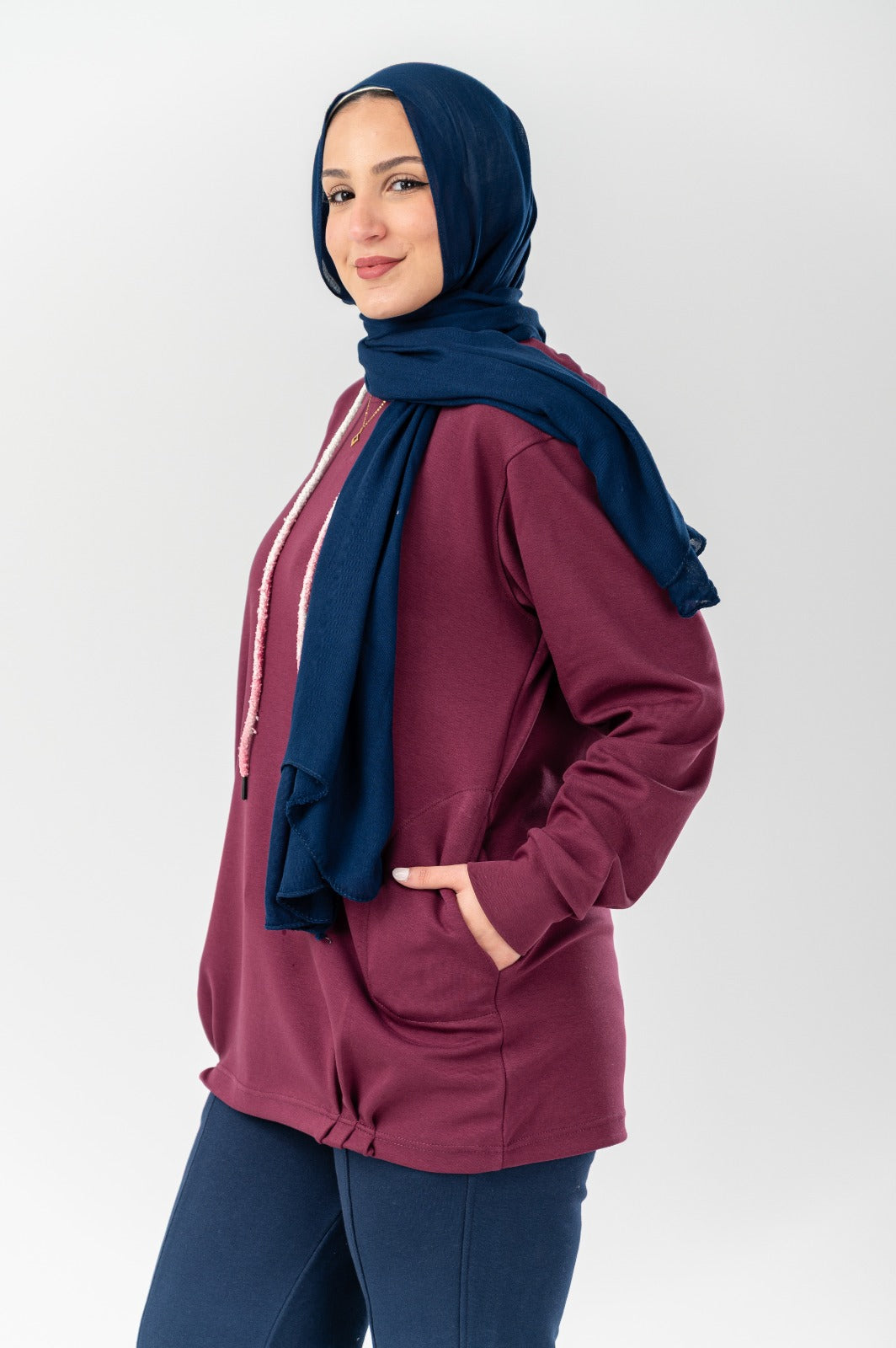 Comforty hoodie by Akira, cozy black sweatshirt with front pocket and drawstring hood, casualwear for everyday comfort.