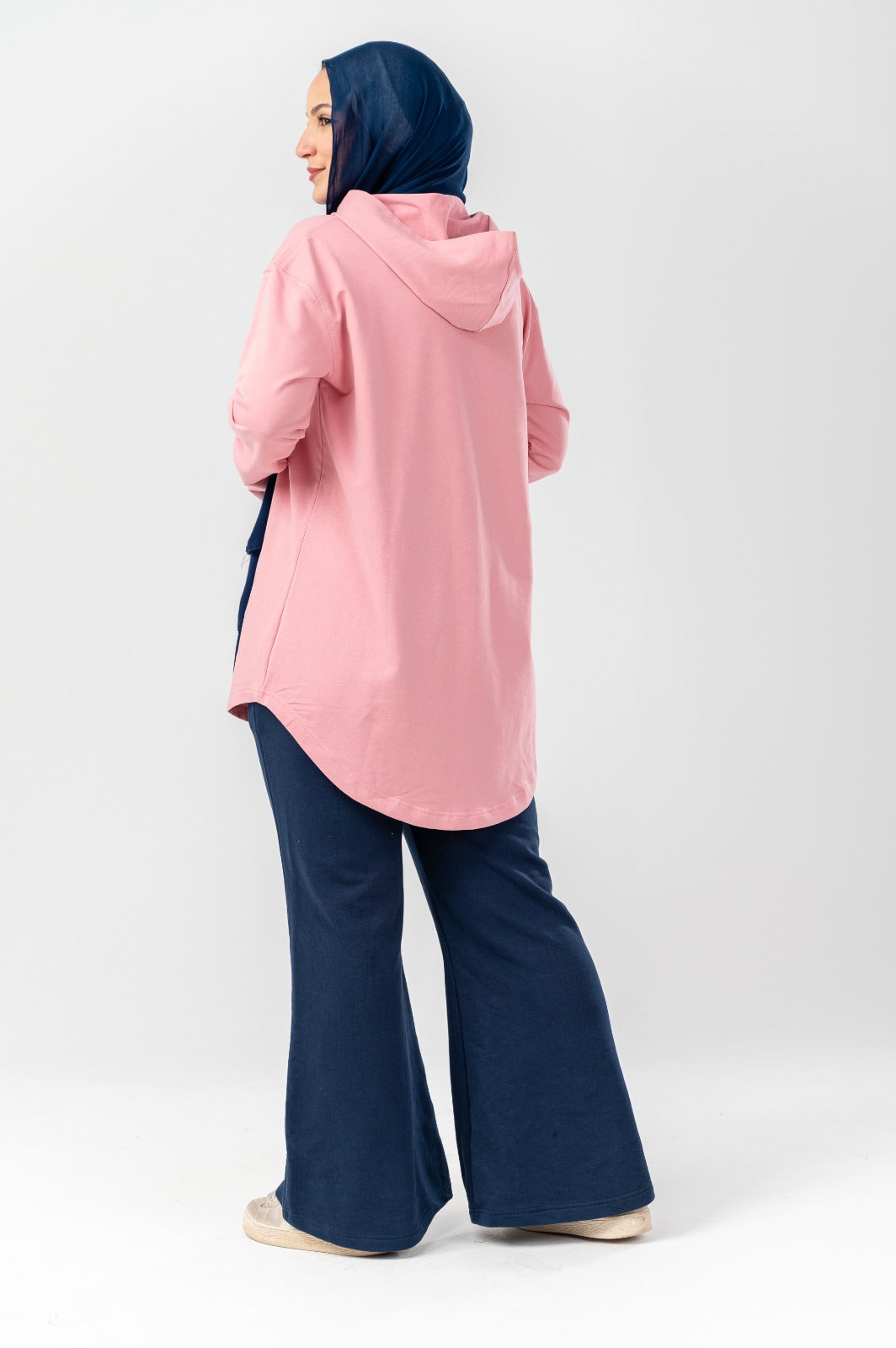 Pink hoodie by Akira, featuring a cozy fit with a front pocket and hood, perfect for casual wear.