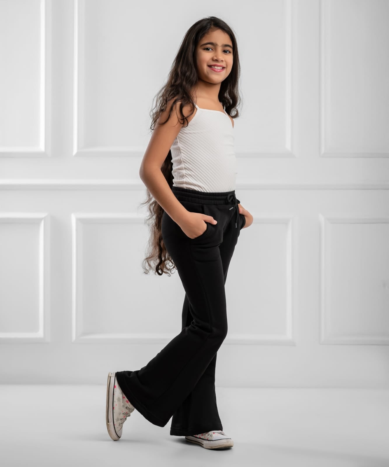 Akira The Weekend Flare Sweatpants in soft fabric with flare leg design, shown in a relaxed fit on a model.