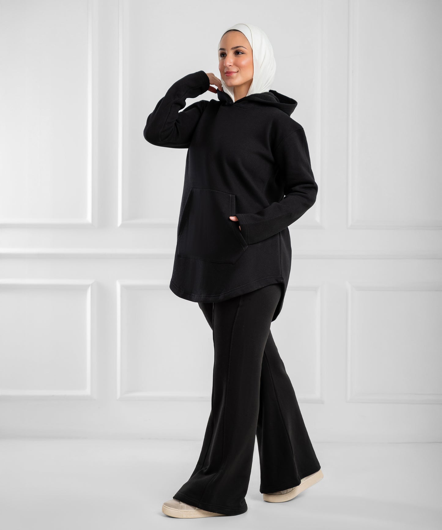 Akira curved-hem fleece tunic hoodie, cozy gray sweatshirt with a relaxed fit and curved hem, casual and comfortable for everyday wear.