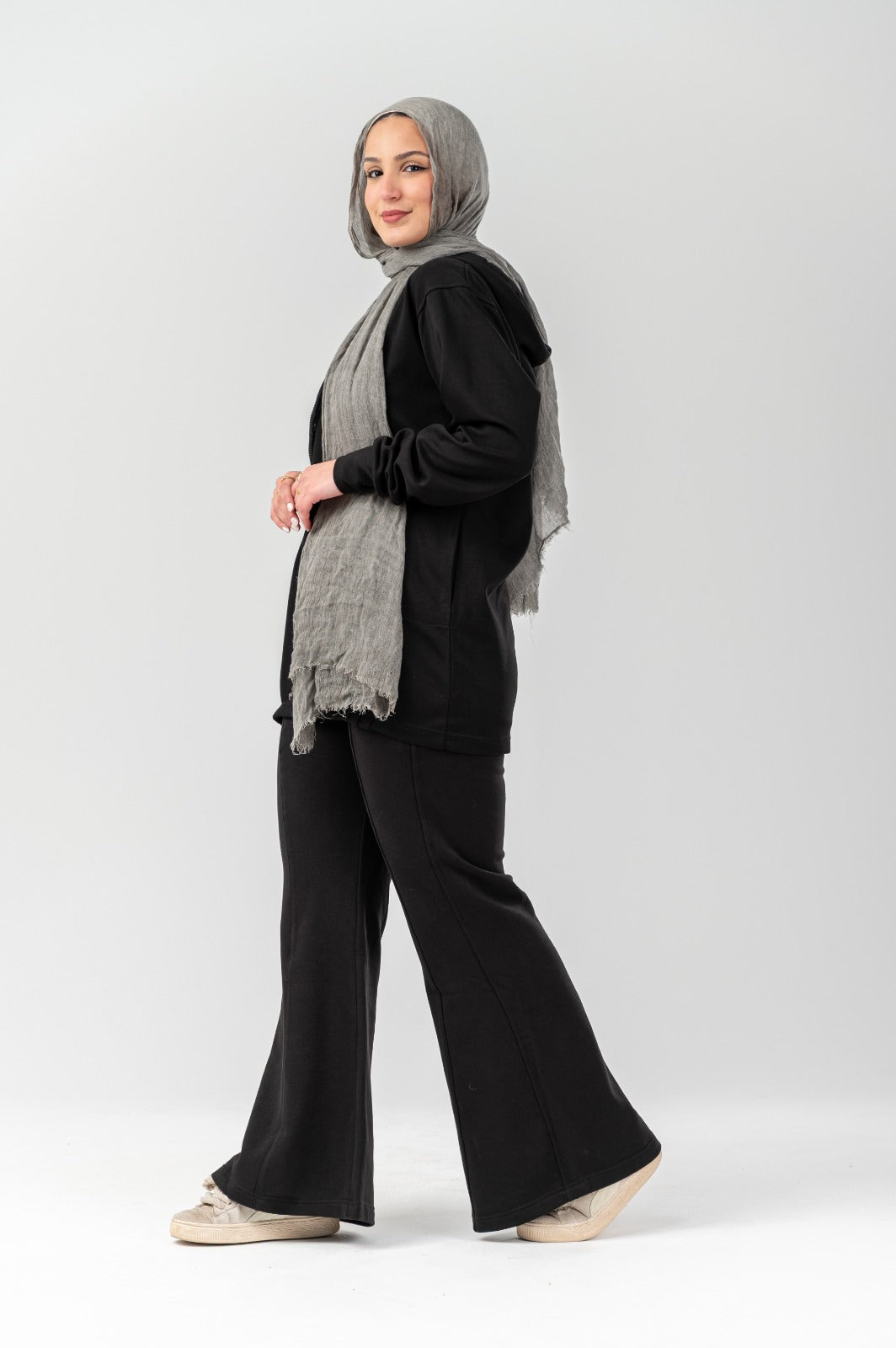 Black comfort hoodie by Akira, featuring a relaxed fit and soft fabric, shown on a hanger against a plain background.