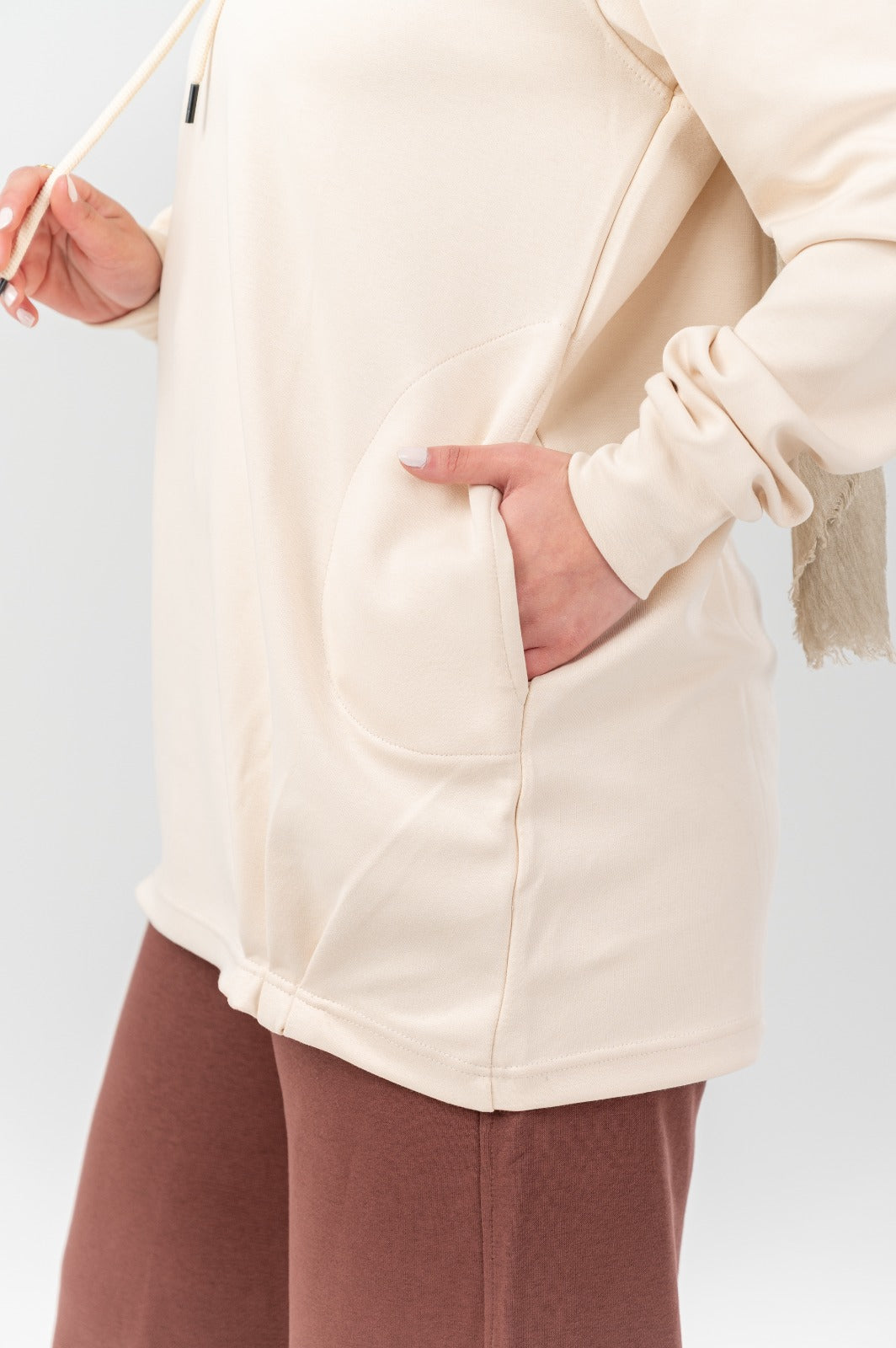 Beige Akira comfort hoodie shown on a model, featuring a relaxed fit, soft fabric, and casual style for everyday wear.