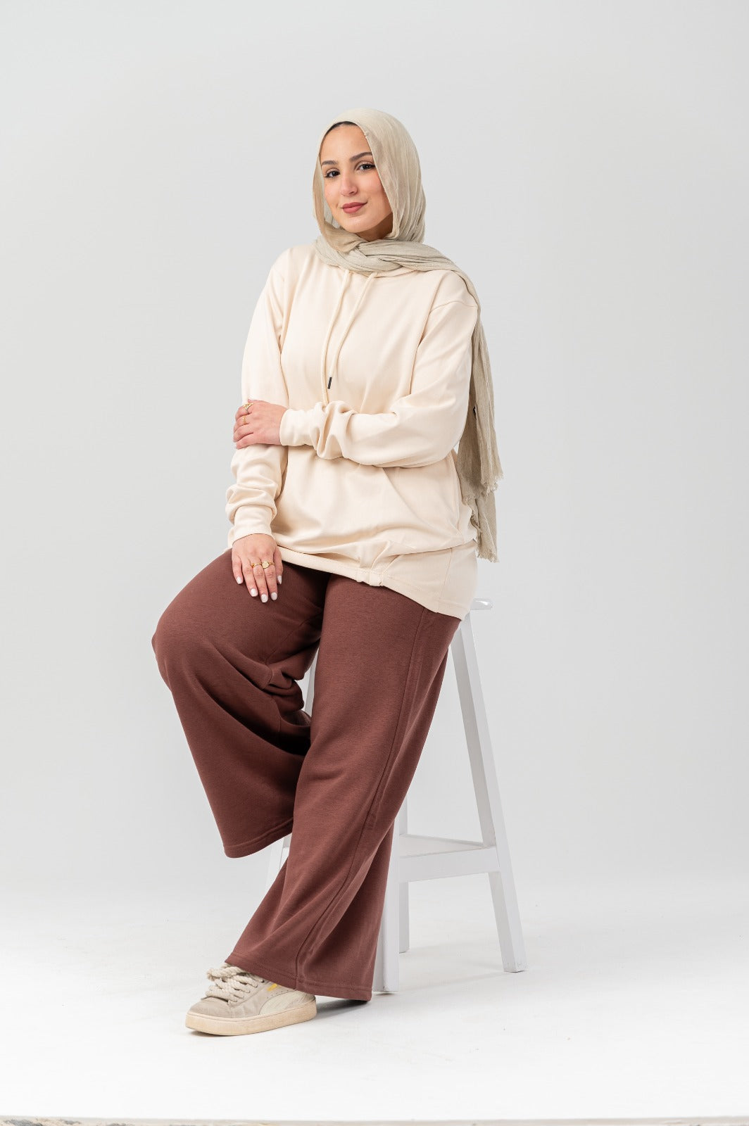 Beige comfort hoodie by Akira, showing a relaxed fit with soft fabric and a hood, ideal for casual wear.