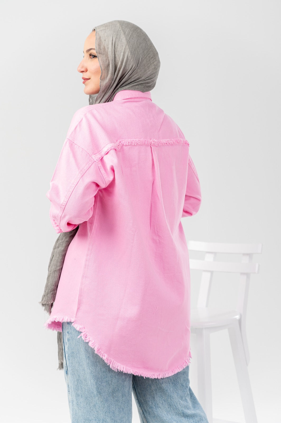 Distressed denim shirt by Akira featuring a casual fit, ruffled details, and a button-up front for stylish everyday wear.