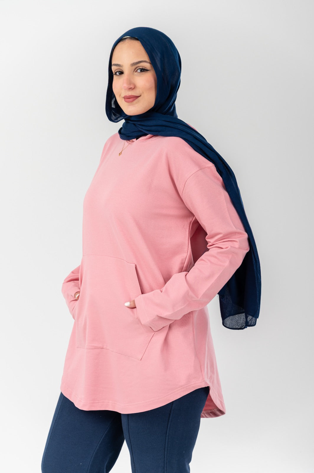 Pink hoodie by Akira, featuring a cozy fit and soft fabric, shown on a mannequin against a plain background.
