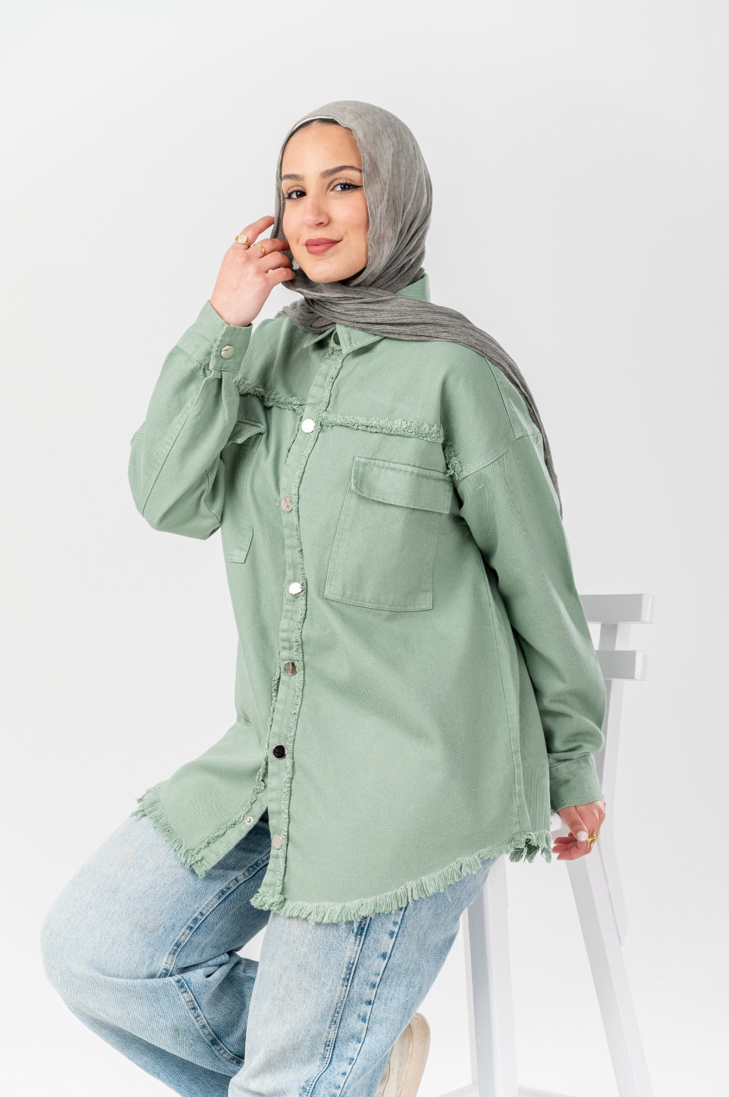 Distressed denim shirt by Akira, featuring a casual fit with ripped details and classic button-down style.