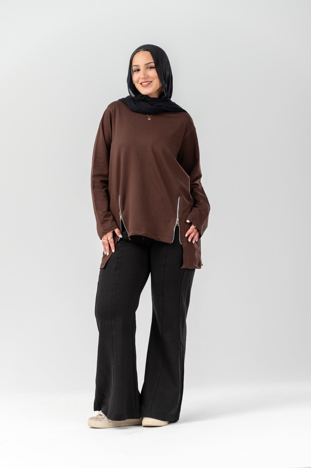 Black side-zip longline T-shirt by Akira, featuring a relaxed fit and extended length with a side zipper detail.