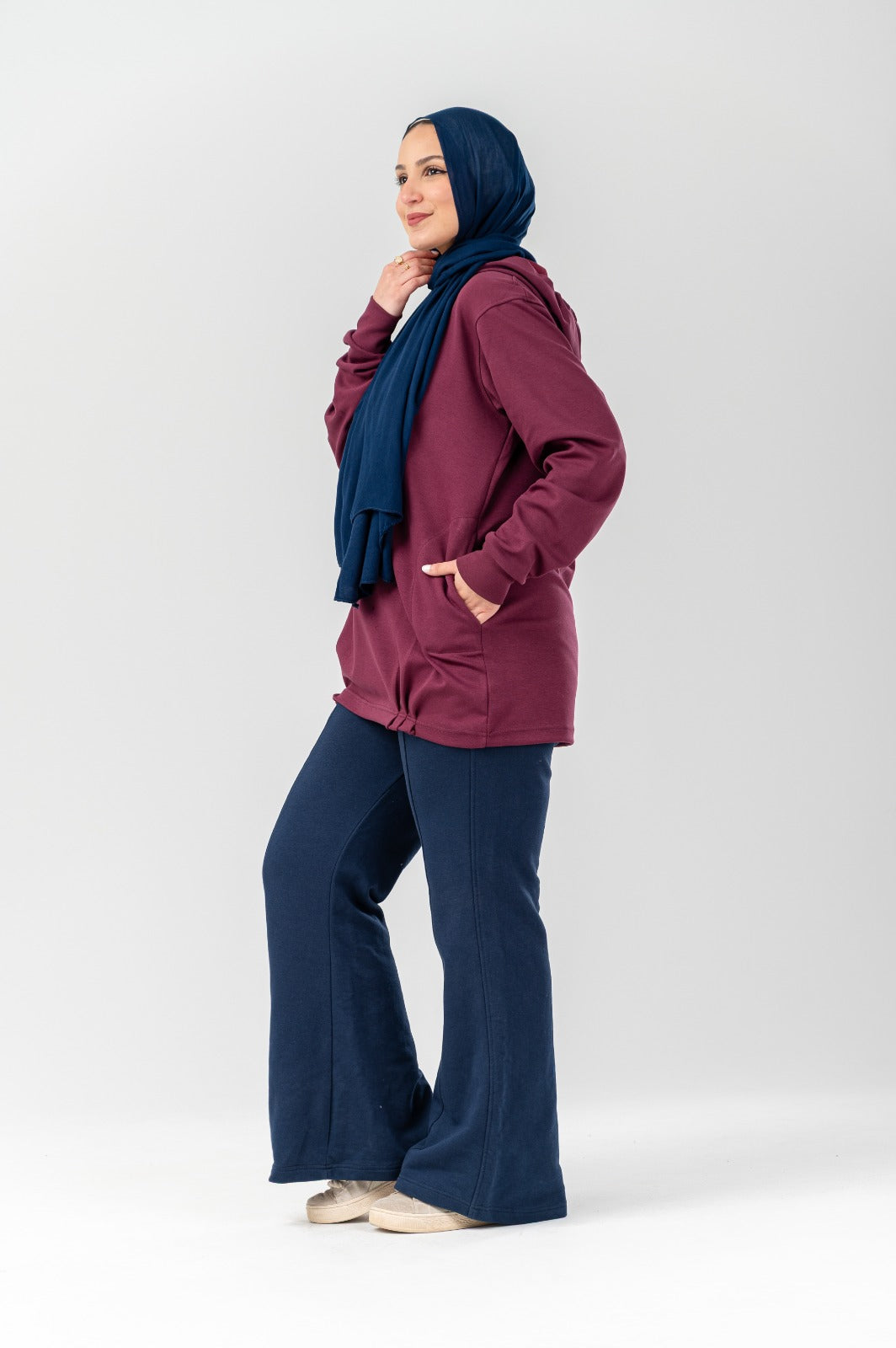 Gray Akira Hoodie Comforty with a relaxed fit and soft fabric, featuring a front pocket and adjustable drawstrings.