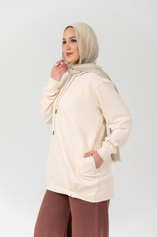 Beige comfort hoodie by Akira, featuring a soft, relaxed fit with a hood and long sleeves, ideal for casual wear.